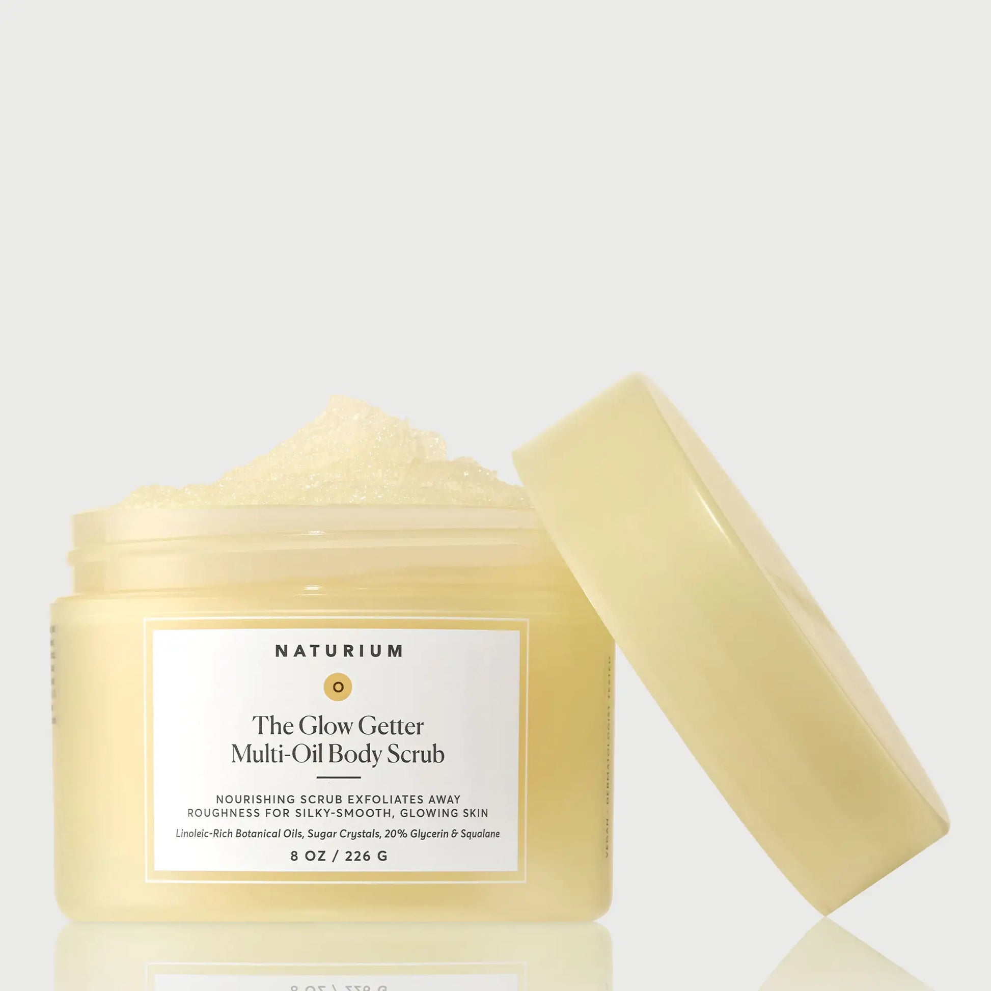 the-glow-getter-multi-oil-body-scrub-t9 NATR-40028-GlowGetter-Multi-Oil-Body-Scrub-Front-CapOff-bonebkgd.webp